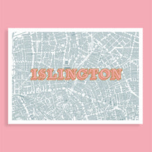 Load image into Gallery viewer, A rectangular city map print of Islington with the word 'ISLINGTON' in large coral letters across the center, shown against a solid pink background.
