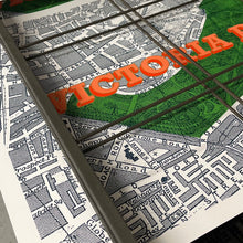 Load image into Gallery viewer, Detail of Victoria Park London map screen print drying on racks in a screen-printing studio
